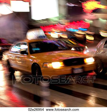 Blurred view of a taxi in Manhattan, New York City, U. S. A. View Large Photo Image Picture - Blurred view of a taxi in Manhattan, New York City, U. S. A.. Fotosearch