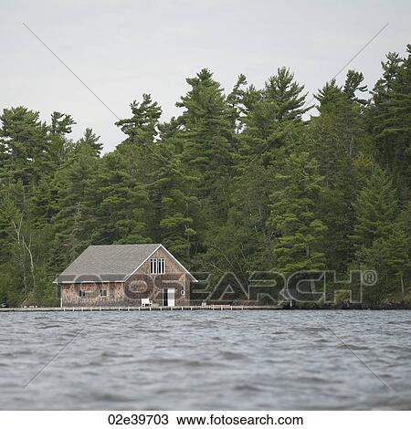 Boat house at shoreline at Lake of the Woods, Ontario View Large Photo Image Stock Image - Boat house at shoreline at Lake of the Woods, Ontario. Fotosearch