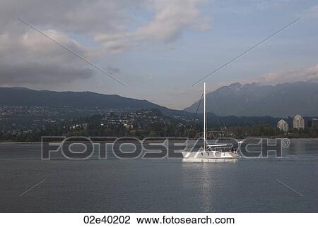 Boat on Coal Harbour in Vancouver British Columbia, Canada View Large Photo Image Stock Image - Boat on Coal Harbour in Vancouver British Columbia, Canada. Fotosearch
