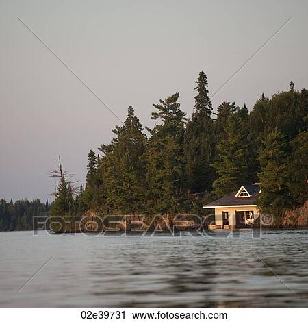 Boathouse at shoreline in Lake of the Woods, Ontario View Large Photo Image Stock Image - Boathouse at shoreline in Lake of the Woods, Ontario. Fotosearch
