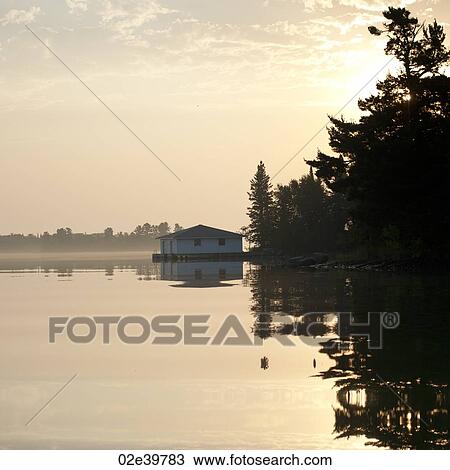 Boathouse at shoreline in Lake of the Woods, Ontario View Large Photo Image Stock Image - Boathouse at shoreline in Lake of the Woods, Ontario. Fotosearch
