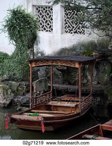 Boats in a canal in the Master of the Nets Garden, Suzhou, Jiangsu Province, China View Large Photo Image Stock Photo - Boats in a canal in the Master of the Nets Garden, Suzhou, Jiangsu Province, China. Fotosearch