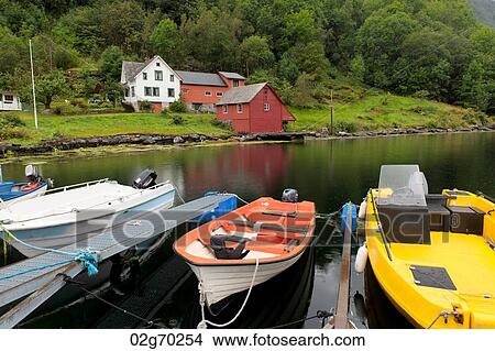 Boats moored with houses in the background, Hardanger, Hardangerfjord, Hardangervidda, Hardanger, Norway View Large Photo Image Picture - Boats moored with houses in the background, Hardanger, Hardangerfjord, Hardangervidda, Hardanger, Norway. Fotosearch
