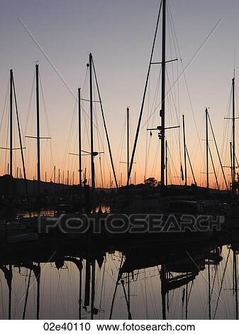 Stock Image - Boats with reflections at the marina in Vancouver, British Columbia, Canada. Fotosearch