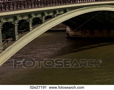 Stock Image - Bridge and Seine River in Paris France. Fotosearch