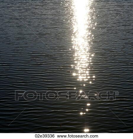 Stock Photograph - Bright sunray on water ripples. Fotosearch