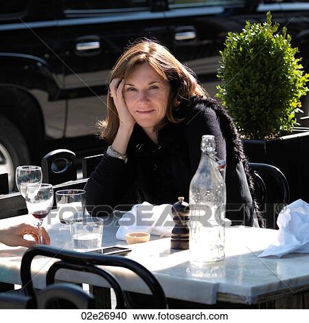 Brunette woman at a outdoor cafe in Manhattan, New York City, U. S. A. View Large Photo Image Stock Image - Brunette woman at a outdoor cafe in Manhattan, New York City, U. S. A.. Fotosearch