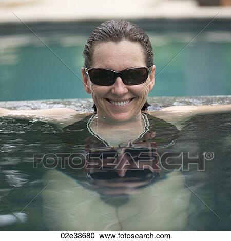 Brunette woman in a pool in Costa Rica View Large Photo Image Stock Image - Brunette woman in a pool in Costa Rica. Fotosearch
