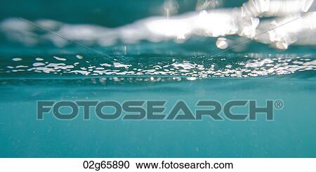 Stock Image - Bubbles underwater, Bartolome Island, Galapagos Islands, Ecuador. Fotosearch