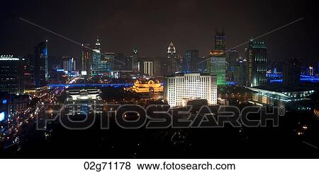 Buildings in a city lit up at night, Shanghai, China View Large Photo Image Stock Photo - Buildings in a city lit up at night, Shanghai, China. Fotosearch
