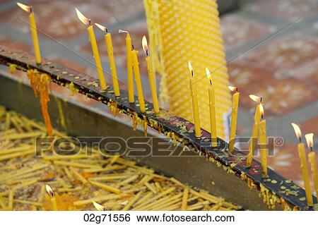 Stock Photograph - Burning candles in a Pra Thad Doi Suthep Pagoda temple, Wat Phrathat Doi Suthep, Chiang Mai, Thailand. Fotosearch