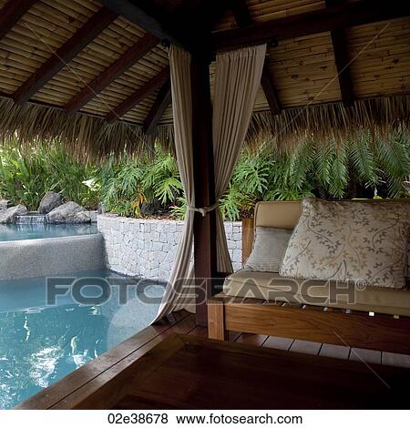 Stock Photo - Cabana by poolside in Costa Rica. Fotosearch