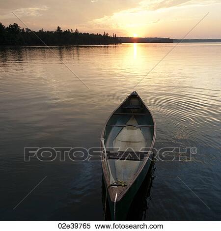 Canoe floating on the water at Lake of the Woods, Ontario View Large Photo Image Stock Photography - Canoe floating on the water at Lake of the Woods, Ontario. Fotosearch