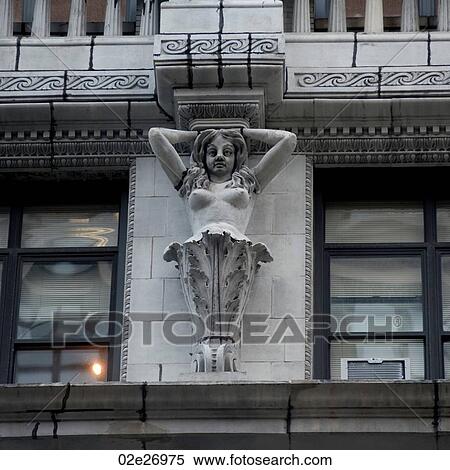Carvings on the exterior of a building in Manhattan, New York City, U. S. A. View Large Photo Image Stock Photography - Carvings on the exterior of a building in Manhattan, New York City, U. S. A.. Fotosearch