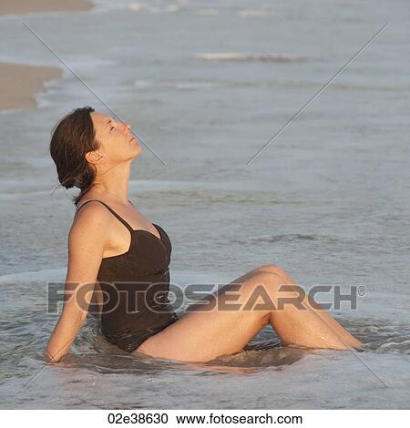 Caucasian woman relaxing in the water along Costa Rica shoreline View Large Photo Image Stock Image - Caucasian woman relaxing in the water along Costa Rica shoreline. Fotosearch