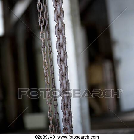 Chains hanging on a wall View Large Photo Image Stock Image - Chains hanging on a wall. Fotosearch