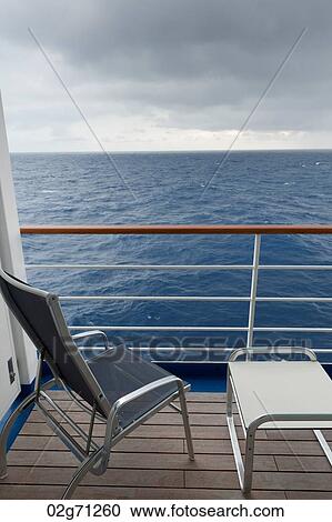 Chair and a stool on the deck of cruise ship Silver Shadow, East China Sea View Large Photo Image Stock Image - Chair and a stool on the deck of cruise ship Silver Shadow, East China Sea. Fotosearch