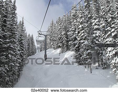 Chair lift on the ski slopes in Vail, Colorado View Large Photo Image Stock Image - Chair lift on the ski slopes in Vail, Colorado. Fotosearch