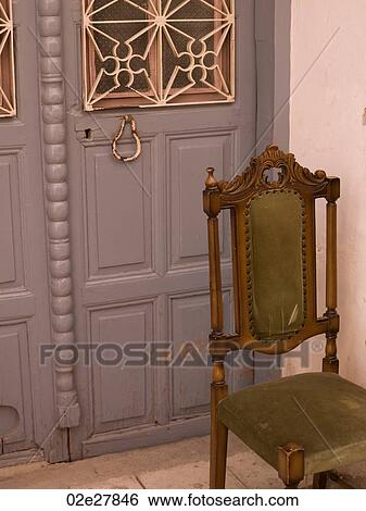 Stock Photograph - Chair outside doorway in Kusadasi Turkey. Fotosearch