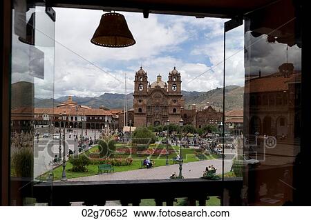 Stock Image - Church viewed through a balcony, Iglesia de la Compania de Jesus, Plaza de Armas, Cuzco, Peru. Fotosearch