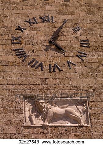 Clock on wall in Rhodes Greece View Large Photo Image Stock Photo - Clock on wall in Rhodes Greece. Fotosearch