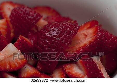 Close up of a pile of sliced red strawberries View Large Photo Image Stock Image - Close up of a pile of sliced red strawberries. Fotosearch
