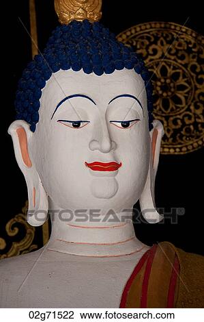 Stock Image - Close-up of a statue of Buddha in Wat Chedi Luang, Chiang Mai, Thailand. Fotosearch