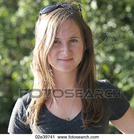 Close up of a young adult woman with long hair View Large Photo Image Stock Image - Close up of a young adult woman with long hair. Fotosearch