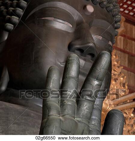 Stock Image - Close up of Buddha statue. . Fotosearch