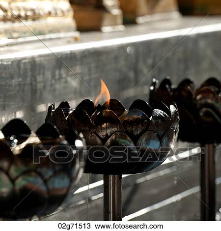 Close-up of oil lamps burning at Wat Phrathat Doi Suthep, Chiang Mai, Thailand View Large Photo Image Stock Image - Close-up of oil lamps burning at Wat Phrathat Doi Suthep, Chiang Mai, Thailand. Fotosearch