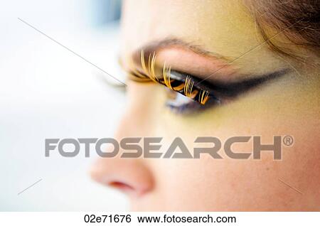 Stock Photograph - Close-up portrait of a glamorous woman with artificial eye lashes. Fotosearch
