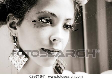 Close-up portrait of a young glamorous woman View Large Photo Image Stock Image - Close-up portrait of a young glamorous woman. Fotosearch