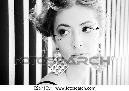 Close-up portrait of a young glamorous woman View Large Photo Image Stock Image - Close-up portrait of a young glamorous woman. Fotosearch