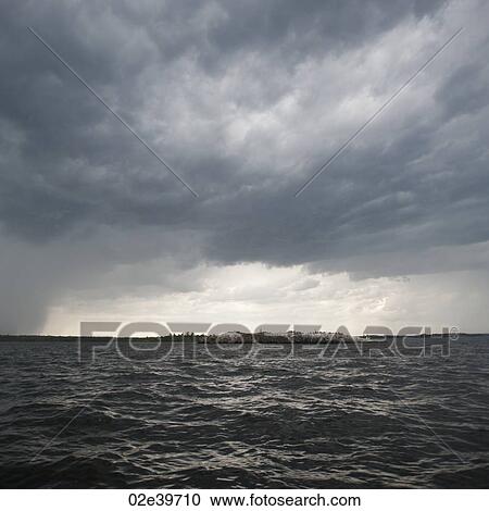 Stock Image - Cloud in the horizon sky over Lake of the Woods, Ontario. Fotosearch