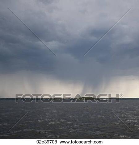 Stock Photo - Cloud in the horizon sky over Lake of the Woods, Ontario. Fotosearch