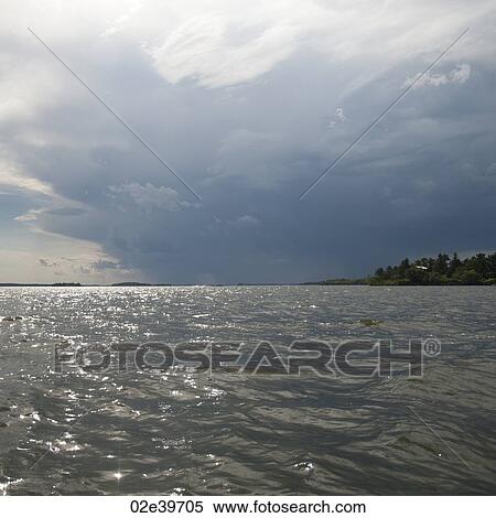 Cloud in the horizon sky over Lake of the Woods, Ontario View Large Photo Image Stock Photography - Cloud in the horizon sky over Lake of the Woods, Ontario. Fotosearch