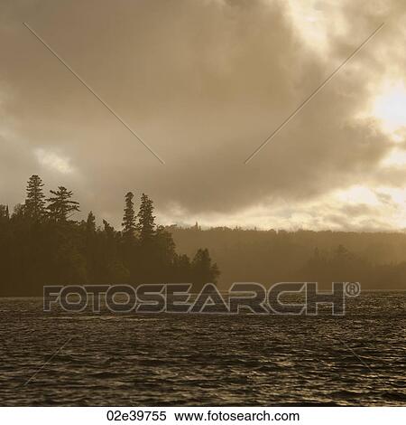 Clouds in the sky over Lake of the Woods, Ontario View Large Photo Image Stock Photography - Clouds in the sky over Lake of the Woods, Ontario. Fotosearch