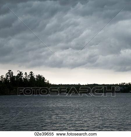 Clouds over Lake of the Woods, Ontario View Large Photo Image Stock Photography - Clouds over Lake of the Woods, Ontario. Fotosearch
