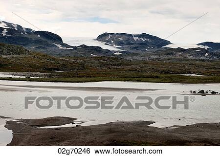 Stock Photograph - Clouds over mountain, Highlands, Norway. Fotosearch
