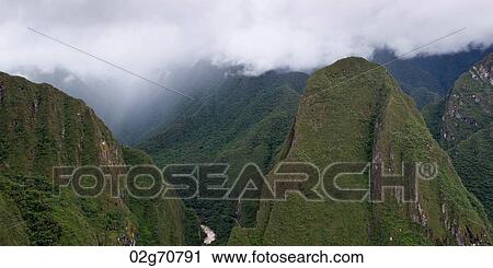 Clouds over mountains at The Lost City of The Incas, Machu Picchu, Cusco Region, Peru View Large Photo Image Stock Image - Clouds over mountains at The Lost City of The Incas, Machu Picchu, Cusco Region, Peru. Fotosearch