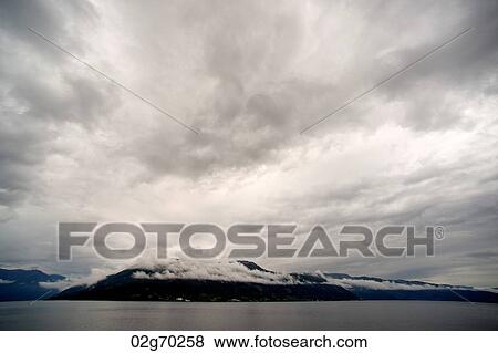 Clouds over the fjord, Hardanger, Hardangerfjord, Hardangervidda, Hardanger, Norway View Large Photo Image Stock Photo - Clouds over the fjord, Hardanger, Hardangerfjord, Hardangervidda, Hardanger, Norway. Fotosearch