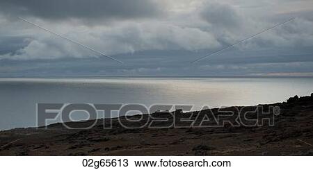 Clouds over the Pacific Ocean, Bartolome Island, Galapagos Islands, Ecuador View Large Photo Image Stock Image - Clouds over the Pacific Ocean, Bartolome Island, Galapagos Islands, Ecuador. Fotosearch
