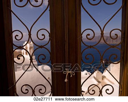 Coastline through decorative window in Santorini Greece View Large Photo Image Stock Image - Coastline through decorative window in Santorini Greece. Fotosearch