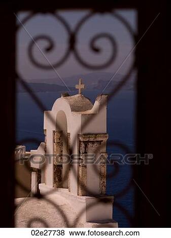 Coastline through decorative window in Santorini Greece View Large Photo Image Stock Photo - Coastline through decorative window in Santorini Greece. Fotosearch