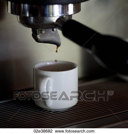 Coffee cup under an expresso maker at Florblanca in Costa Rica View Large Photo Image Stock Image - Coffee cup under an expresso maker at Florblanca in Costa Rica. Fotosearch