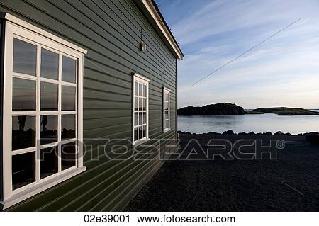 Colourful lakeside dwelling with three multi-paned windows drawing perspective towards the horizon View Large Photo Image Stock Image - Colourful lakeside dwelling with three multi-paned windows drawing perspective towards the horizon. Fotosearch
