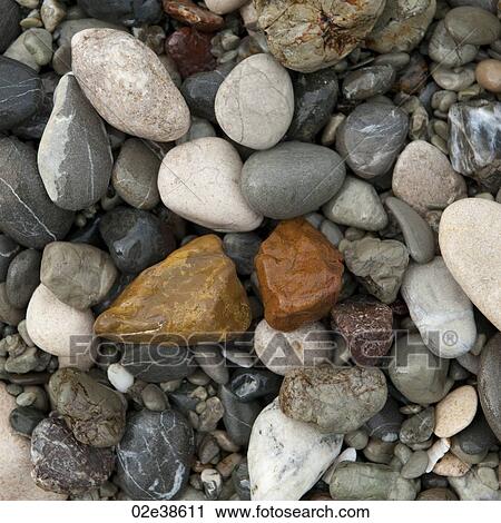 Stock Image - Colourful stones along shoreline in Costa Rica. Fotosearch