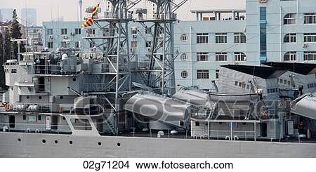 Container ship in front of buildings, Yangtze River, Shanghai, China View Large Photo Image Picture - Container ship in front of buildings, Yangtze River, Shanghai, China. Fotosearch