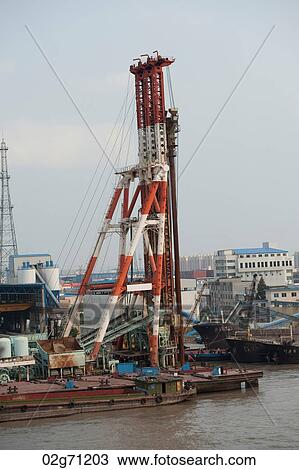 Cranes at a commercial dock, Yangtze River, Shanghai, China View Large Photo Image Stock Image - Cranes at a commercial dock, Yangtze River, Shanghai, China. Fotosearch