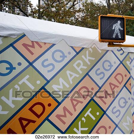 Stock Image - Crosswalk sign in Manhattan, New York City, U. S. A.. Fotosearch